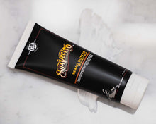 4 fl oz Beard Butter Whiskey Bar Fragrance with product beneath it 