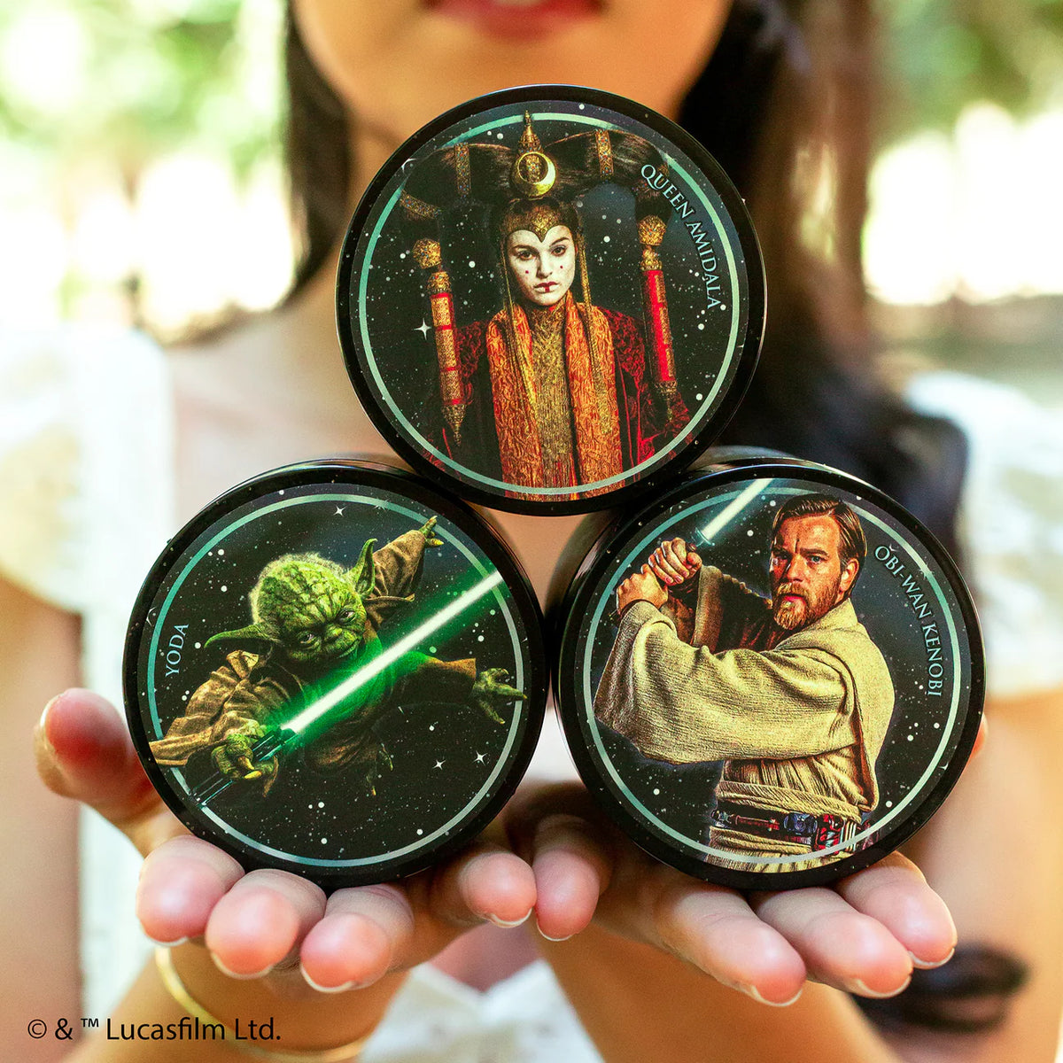 Three Suavecito Pomade containers featuring Star Wars characters: Queen Amidala, Yoda and Obi-Wan.