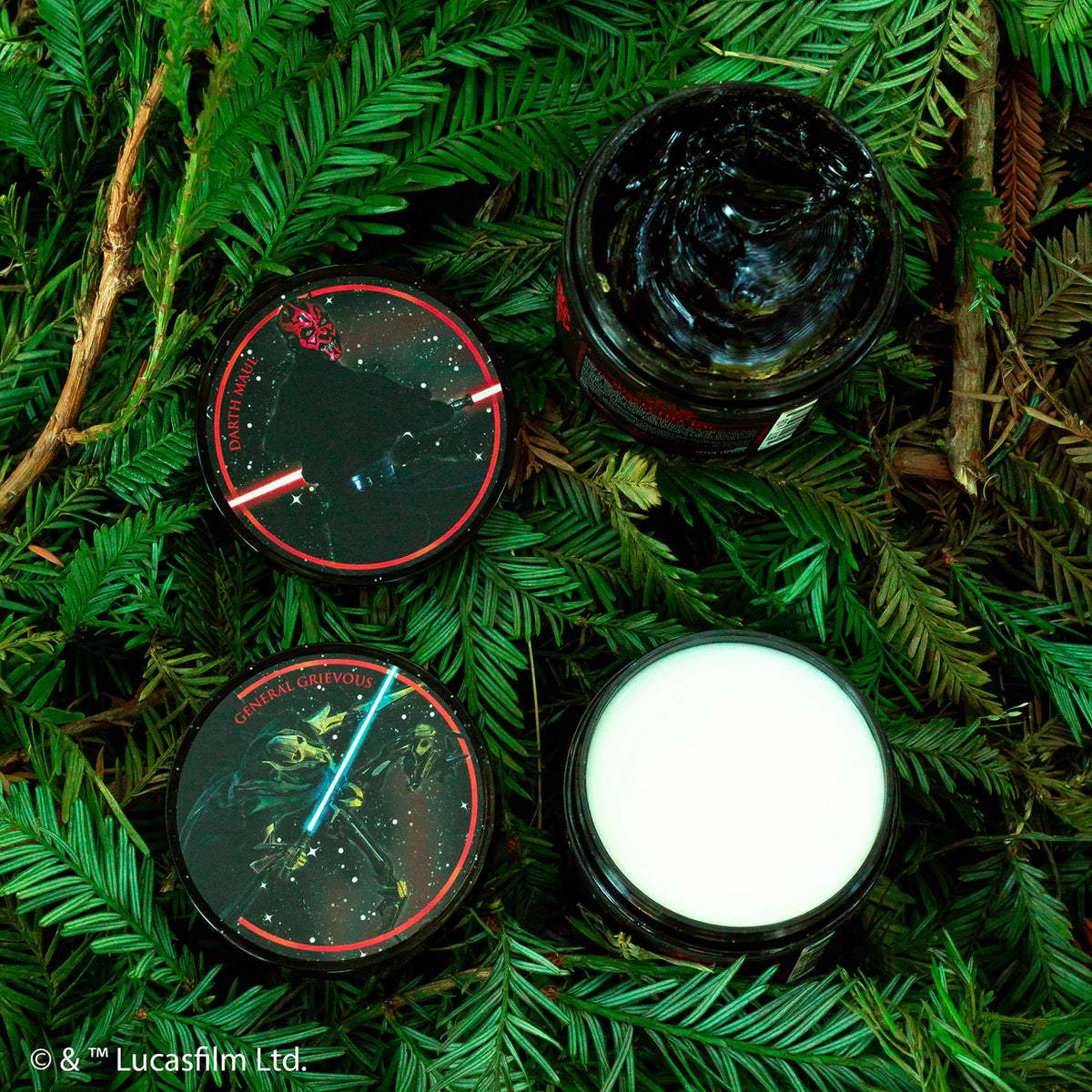 Four cosmetic jars with glowing elements on a green leafy background, featuring branding.