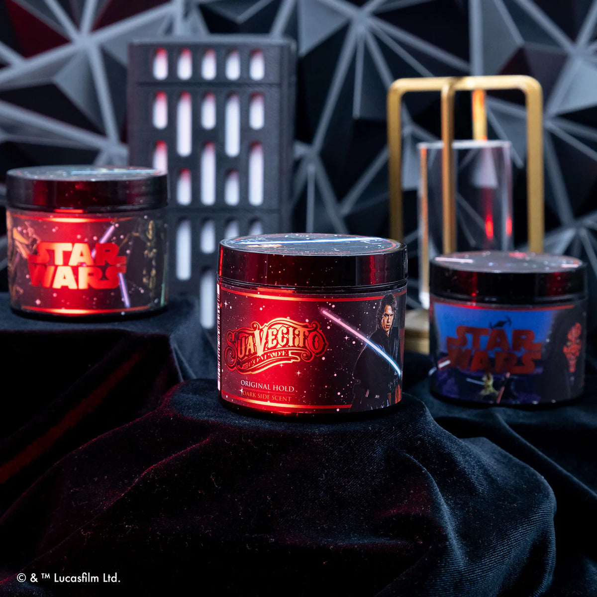 Three jars of Suavecito Original Hold hair gel with Star Wars branding on a dark background.