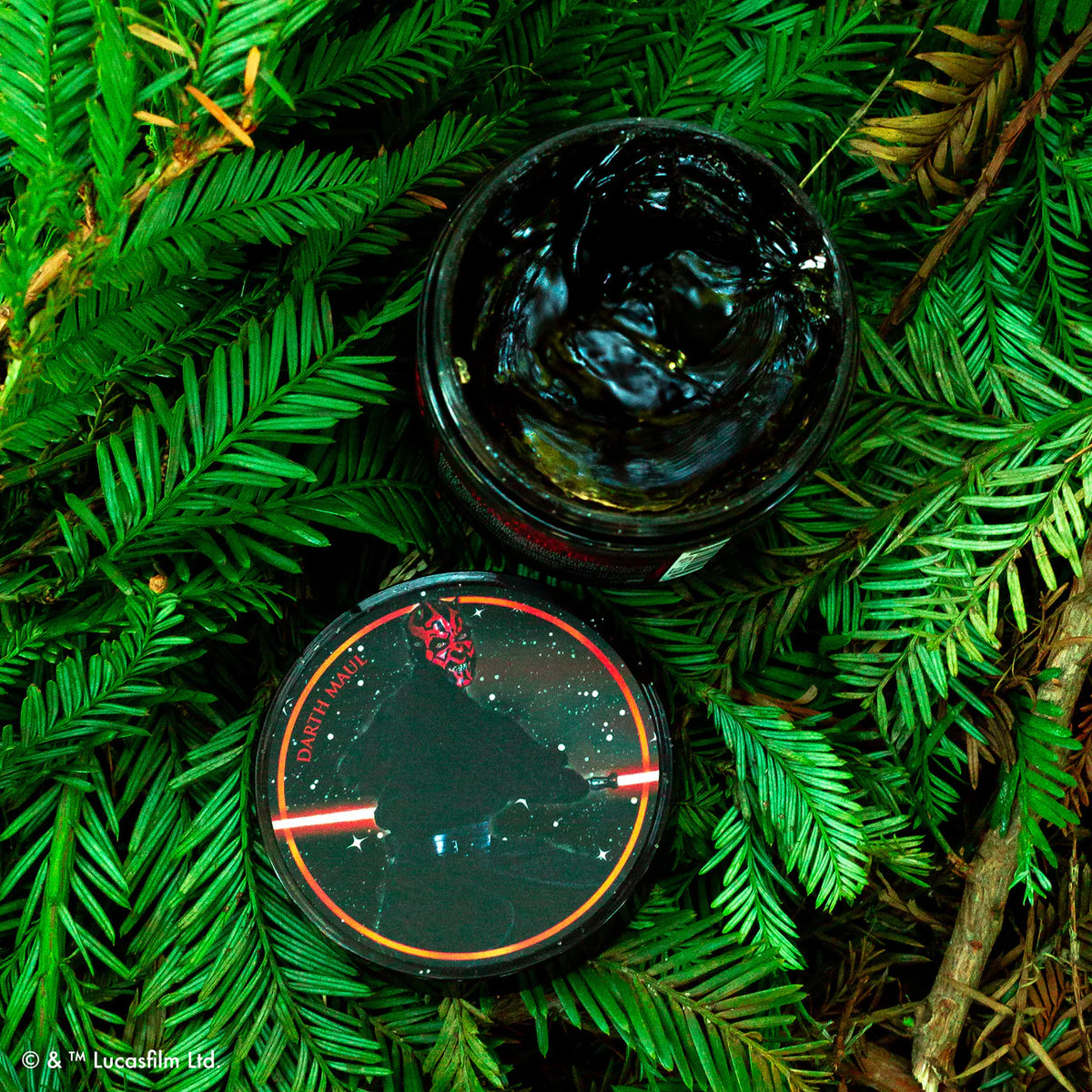 Jar of the Darth Maul Firme Hold Pomade with a lid featuring a starry night design on green leaves