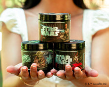 Hands holding all three Star Wars Light Side Pomades.